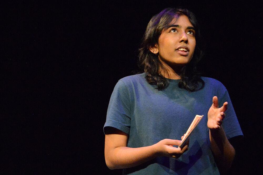 Oviya NagarajPrema, a second-year studying art and design, reminisces&#160; during the performance of "What We Grew Up With" at Kennedy-McIlwee Studio Theatre on Thursday, Nov. 2, 2023. The play follows an immigrant family and their experiences navigating racism, xenophobia, and estrangement.