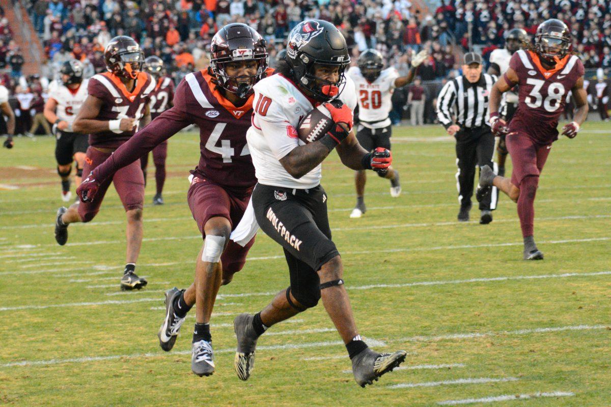 Freshman wide receiver Kevin "KC" Concepcion runs into the end zone to score a touchdown during the game against Virginia Tech at Lane Stadium on Saturday, Nov. 18, 2023. Wolfpack beat the Hokies 35-28.