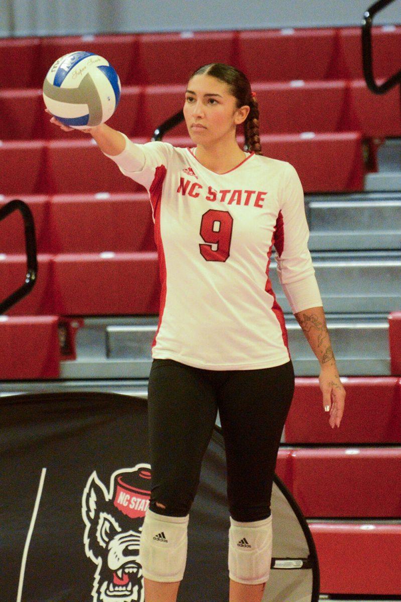 Senior libero Skye Stokes prepares for a serve during the volleyball match against Syracuse at Reynolds Coliseum on Sunday, Nov. 5, 2023. NC State beat&#160; Syracuse 3-0.