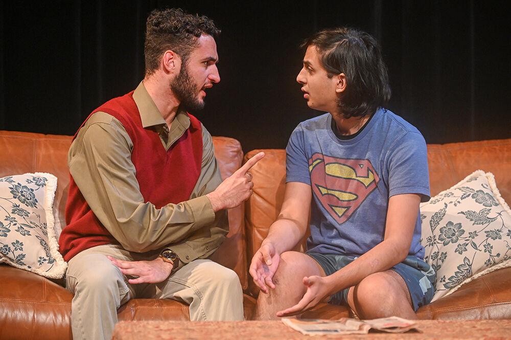 Andrew Jackson (left), a third-year studying political science, scolds Fayaz Shaikh (right), a fourth-year studying computer engineering, during the performance of "What We Grew Up With" in Kennedy-McIlwee Studio Theatre on Thursday, Nov. 2, 2023. "What We Grew Up With" deals with themes of xenophobia, racism, and estrangement in a post-9/11 America.