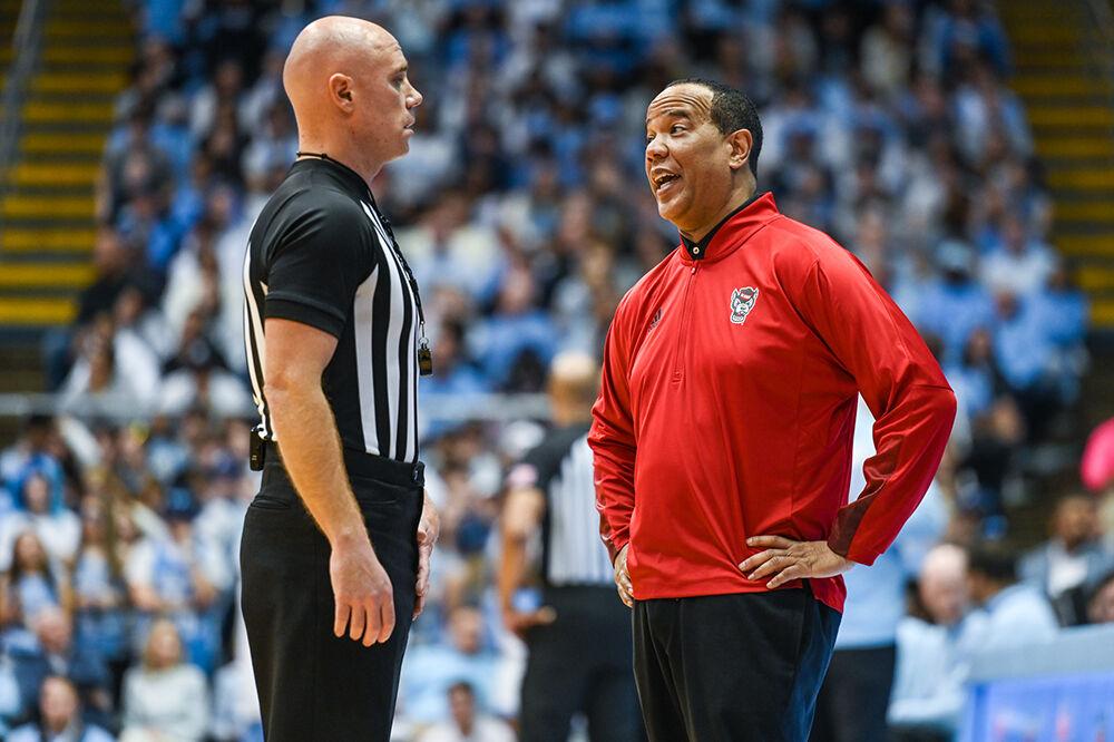 NC State head coach Kevin Keatts talks with a referee during the game versus the UNC-Chapel Hill Tar Heels in the Dean E. Smith Center on Saturday, Jan. 21, 2023. The Wolfpack lost to the Tar Heels 80-69.