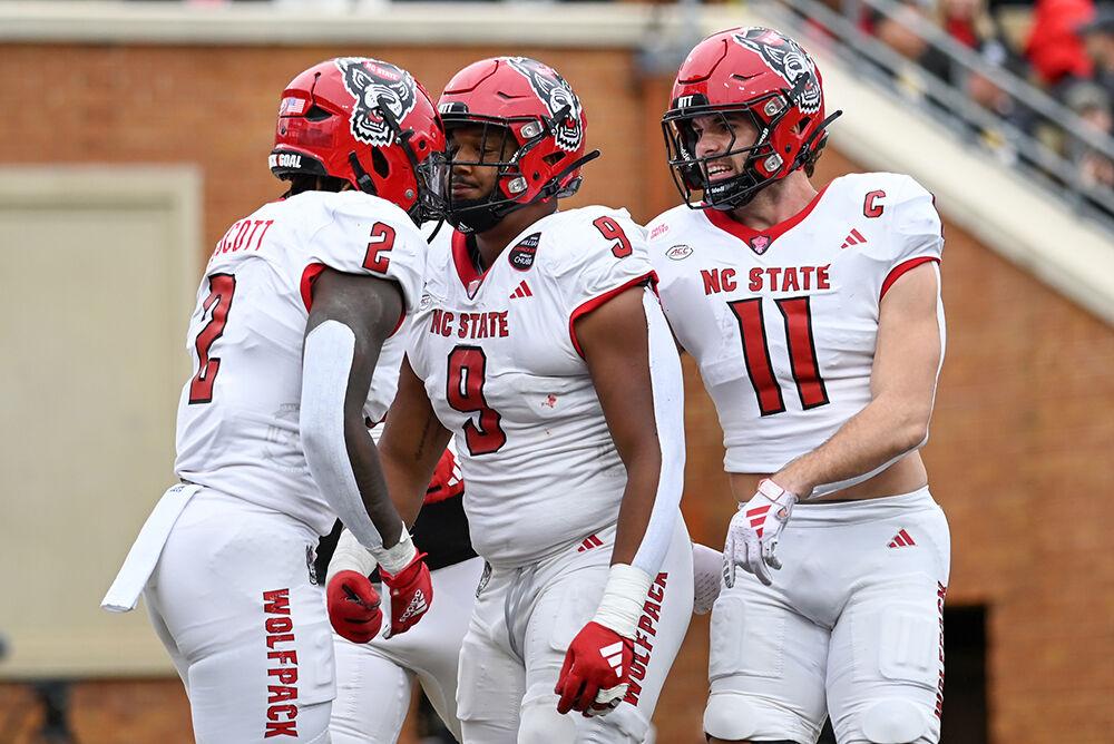 Senior defensive end Savion Jackson (center) celebrates a successful sack with his teammates during the game against Wake Forest at Allegacy Federal Credit Union Stadium on Saturday, Nov. 11, 2023. Jackson completed four tackles, two sacks and two tackles for loss. NC State beat Wake Forest 26-6.