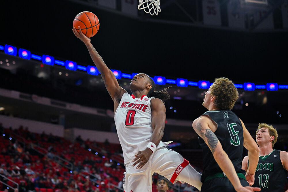 Graduate guard DJ Horne goes up for a layup during the game versus the Mount Olive Trojans in PNC Arena on Wednesday, Nov. 1, 2023. Horne scored 12 points against Mount Olive. The Wolfpack beat the Trojans 89-79.