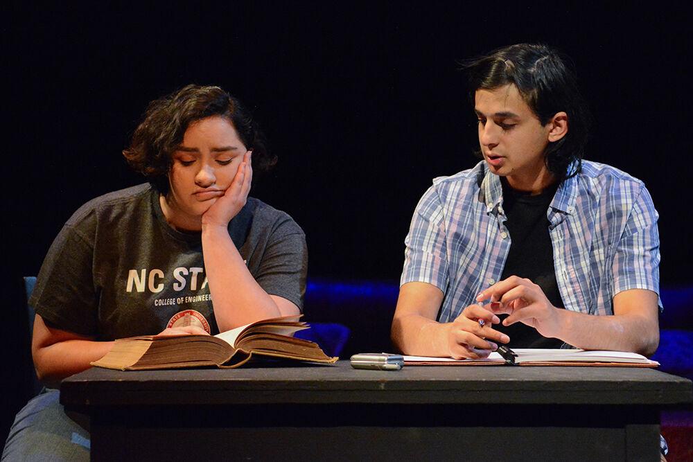 Greta Estefania Perez Cobo, a third-year studying sociology and industrial engineering, and Fayaz Shaikh, a fourth-year studying computer engineering, have a heart-to-heart during the performance of "What We Grew Up With" at Kennedy-McIlwee Studio Theatre on Thursday, Nov. 2, 2023. The play was written by Kiran Soma, winner of the 2023 Creative Artist Award in Theatre.