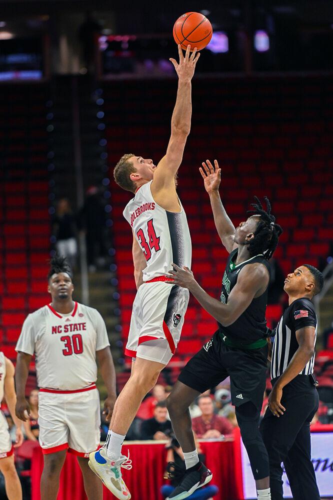Junior forward Ben Middlebrooks gets the tipoff ball over the Mount Olive Trojans in PNC Arena on Wednesday, Nov. 1, 2023. Middlebrooks had seven rebounds against Mount Olive. The Wolfpack beat the Trojans 89-79.
