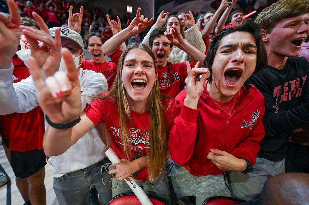 The NC State student section celebrates the NC State women's basketball team's win over the UConn Huskies in Reynolds Coliseum on Sunday, Nov. 12, 2023. The Wolfpack beat the Huskies 92-81.