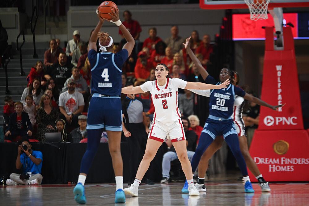 Graduate forward Mimi Collins defends her opponenet during the game against Rhode Island in Reynolds Coliseum on Sunday, Nov. 19, 2023. The Wolfpack beat the Rams 67-58.