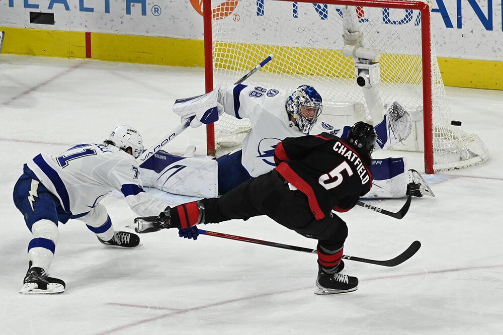 Carolina defenseman Jalen Chatfield shoots during the Hurricanes' home game against the Tampa Bay Lightning in PNC Arena on Sunday, March 5, 2023. The Canes beat the Lightning 6-0.