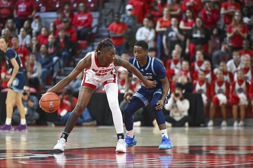 Junior guard Saniya Rivers keeps the ball away from her opponent during the basketball game against Rhode Island in Reynolds Coliseum on Sunday, Nov. 19, 2023. Rivers scored 19 points. NC State beat Rhode Island 67-58.