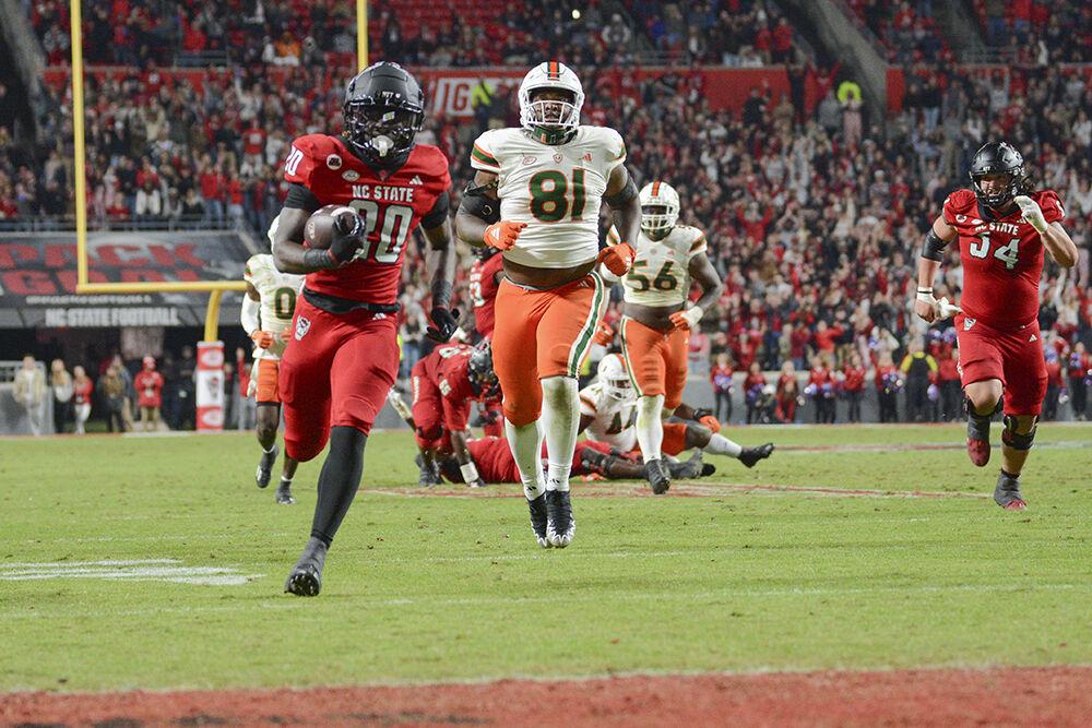 Freshman running back Kendrick Raphael runs to the end zone during the football game against Miami at Carter-Finley Stadium on Saturday, Nov. 4, 2023. Raphael scored one touchdown and rushed for 41 net yards. NC State beat Miami 20-6.