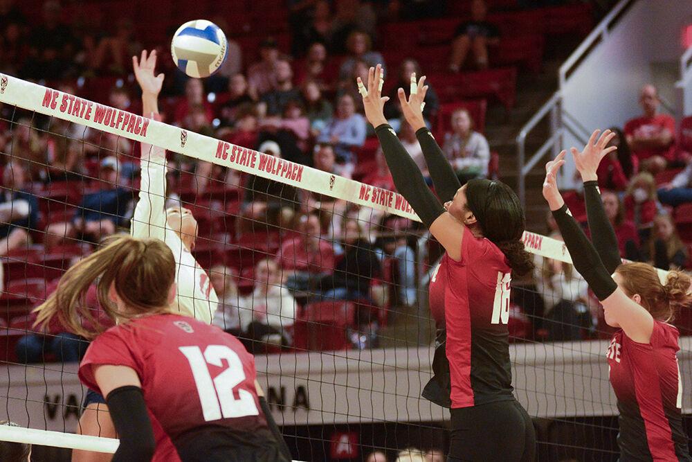 Junior opposite hitter Amanda Rice, junior middle blocker Jada Allen, and sophomore outside hitter Courtney Bryant attempt to block the ball during the volleyball match against Syracuse at Reynolds Coliseum on Sunday, Nov. 5, 2023. NC State beat Syracuse 3-0.