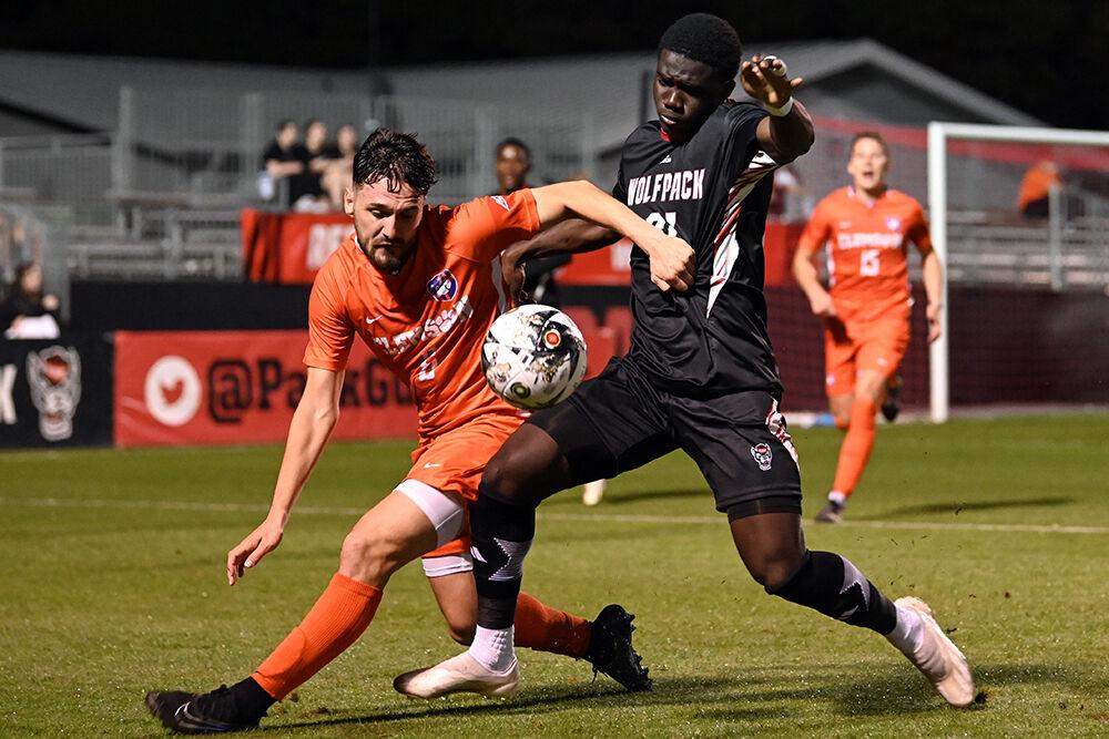 Freshman right wing Hakim Karamoko attempts to steal the ball during the match against Clemson at Dail Soccer Field on Friday, Oct. 27, 2023. Karamoko scored one goal. NC State and Clemson tied 1-1.