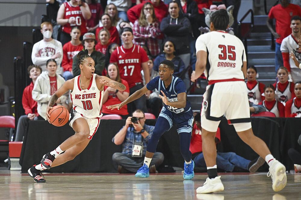 Junior guard Azaiah James dribbles the ball forward during the basketball game against Rhode Island in Reynolds Coliseum on Sunday, Nov. 19, 2023. James scored 17 points. NC State beat Rhode Island 67-58.