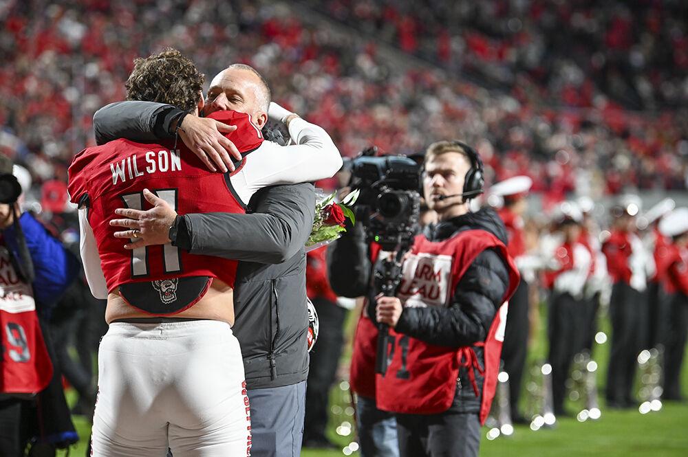 Graduate linebacker Payton Wilson hugs NC State football head coach Dave Doeren before the game against UNC-Chapel Hill in Carter-Finley Stadium on Saturday, Nov. 25, 2023. This game against UNC also served as senior night for the NC State football team. NC State beat UNC 39-20.