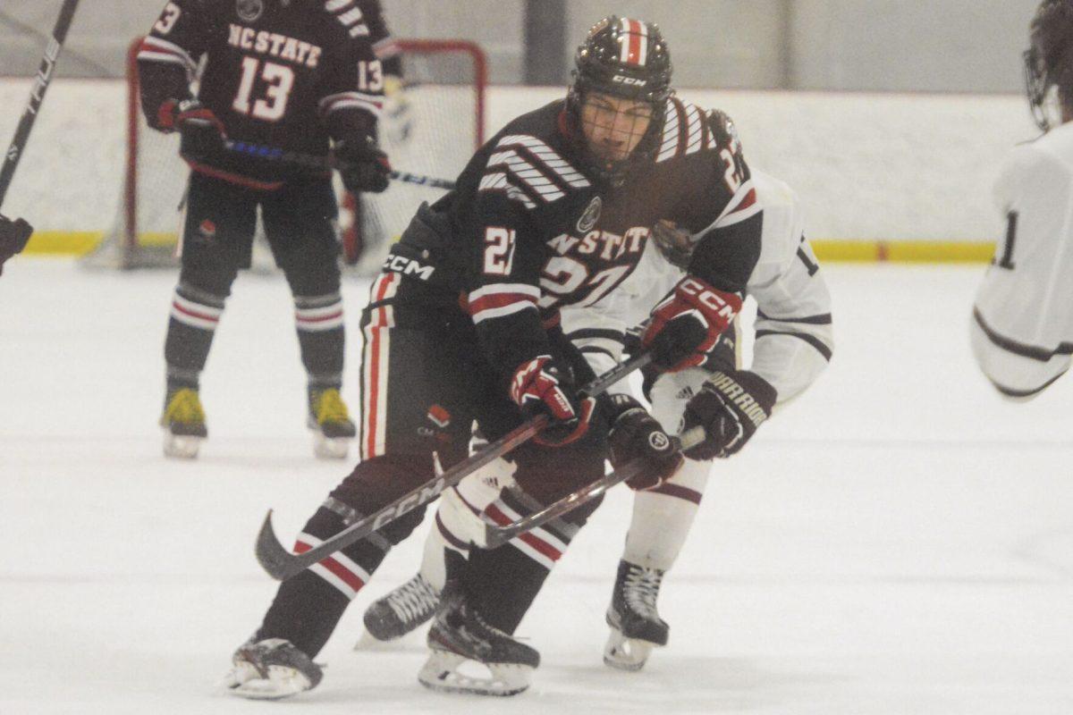 Freshman forward Nick Shook blocks an opponent from taking the puck during the game against Texas A&amp;M in the Invisalign Arena on Saturday, Nov. 11, 2023. Shook scored three points during the game. The Icepack beat Texas A&amp;M 8-2.