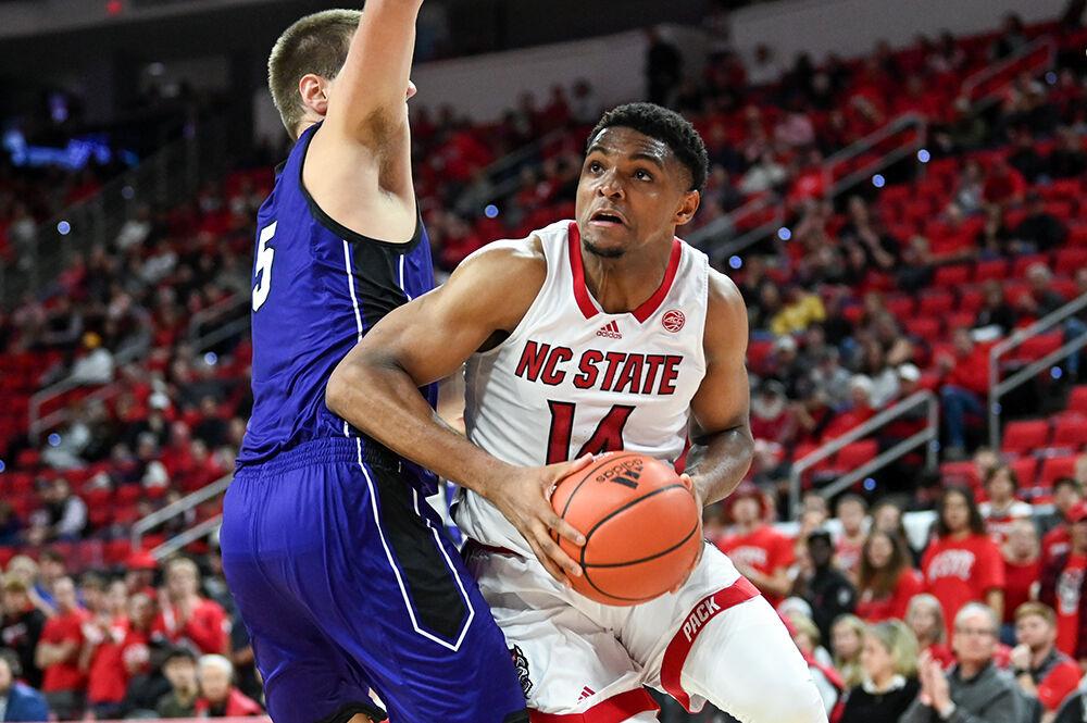 Graduate forward Casey Morsell drives around the defense during the game against Abilene Christian in PNC Arena on Friday, Nov. 10, 2023. Morsell scored 16 points and made three rebounds. NC State beat Abilene Christian 84-64.