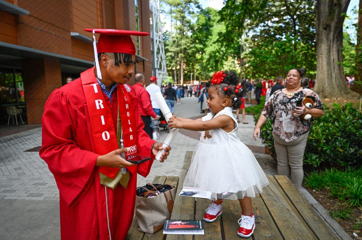 Undergraduate students participate in commencement (graduation) during departmental graduations at Reynolds Coliseum.&#160;