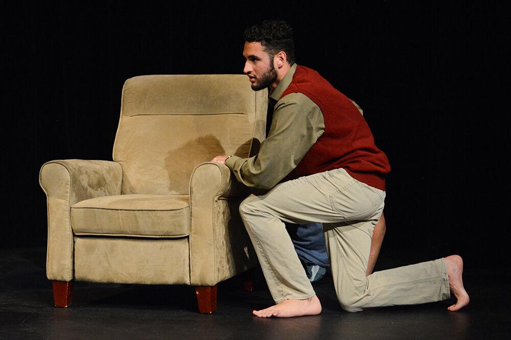 Andrew Jackson, a third-year studying political science, shields another character during the performance of "What We Grew Up With" at Kennedy-McIlwee Studio Theatre on Thursday, Nov. 2, 2023. The play was written by Kiran Soma, winner of the 2023 Creative Artist Award in Theatre.