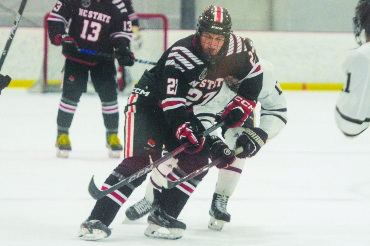 Freshman forward Nick Shook blocks an opponent from taking the puck during the game against Texas A&amp;M in the Invisalign Arena on Saturday, Nov. 11, 2023. Shook scored three points during the game. The Icepack beat Texas A&amp;M 8-2.
