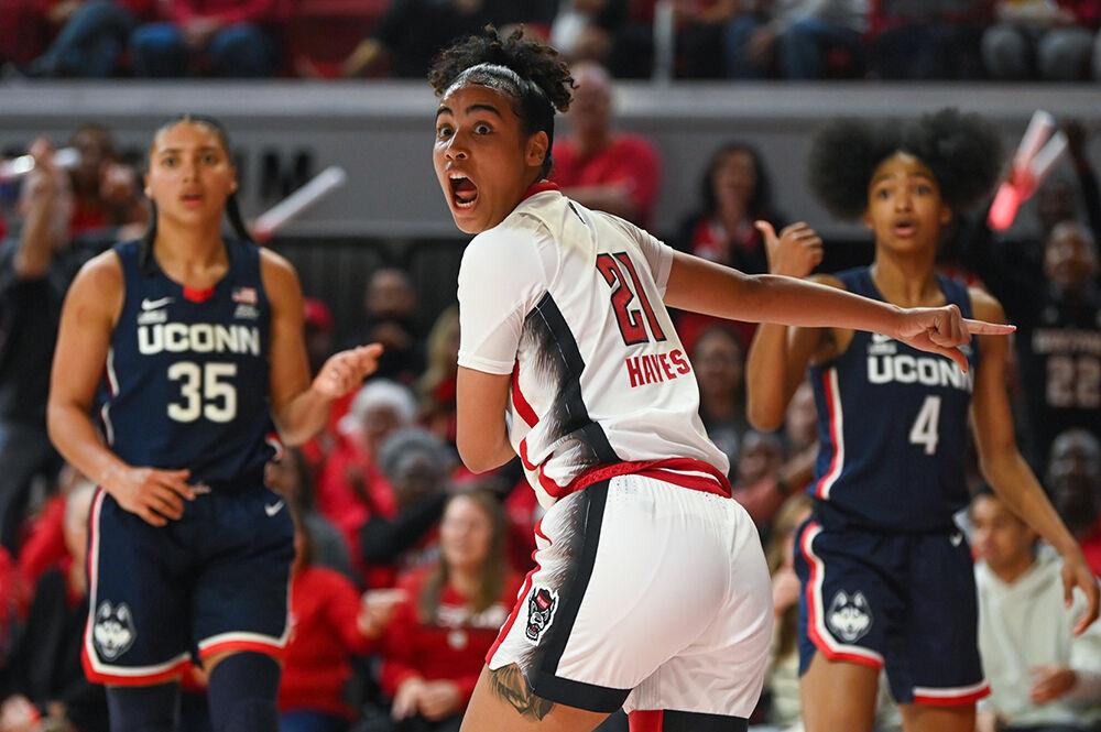 Senior guard Madison Hayes argues for possession of an outbound ball during the game versus the UConn Huskies in Reynolds Coliseum on Sunday, Nov. 12, 2023. Hayes scored ten points and had four assists against UConn. The Wolfpack beat the Huskies 92-81.