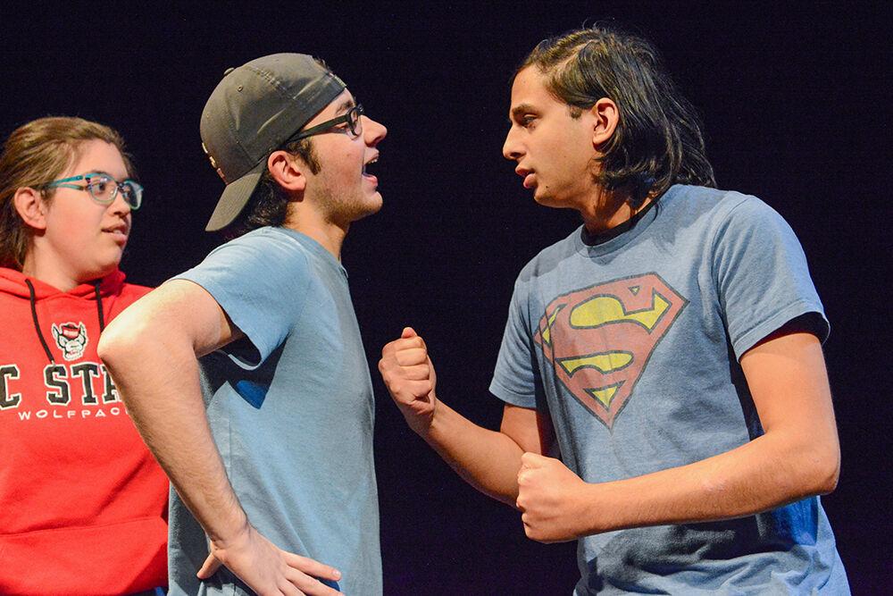 Tyler Negley, a first-year in exploratory studies, and Fayaz Shaikh, a fourth-year studying computer engineering, are caught in a heated exchange during the performance of "What We Grew Up With" at Kennedy-McIlwee Studio Theatre on Thursday, Nov. 2, 2023. "What We Grew Up With" runs from Nov. 2-5, 2023.