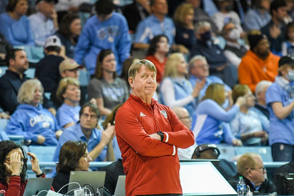 Head coach Wes Moore eyes the activities of the game against UNC-Chapel Hill inside Carmichael Arena&#160;on Sunday, Jan. 15, 2023. NC State suffered a loss to UNC-Chapel Hill 56-47.