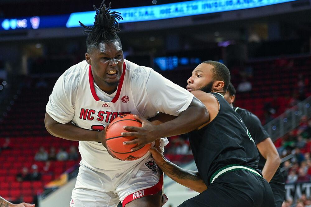Graduate forward DJ Burns pushes to the basket during the exhibition game versus the Mount Olive Trojans in PNC Arena on Wednesday, Nov. 1, 2023. Burns scored 13 points against Mount Olive. The Wolfpack beat the Trojans 89-79.