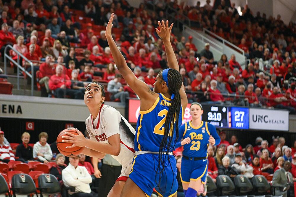 Junior guard Madison Hayes eyes the net in the game against Pitt inside Reynolds Coliseum on Sunday, Feb. 26, 2023. Hayes made seven rebounds, three steals and one block for the Pack. NC State won the game 68-63.