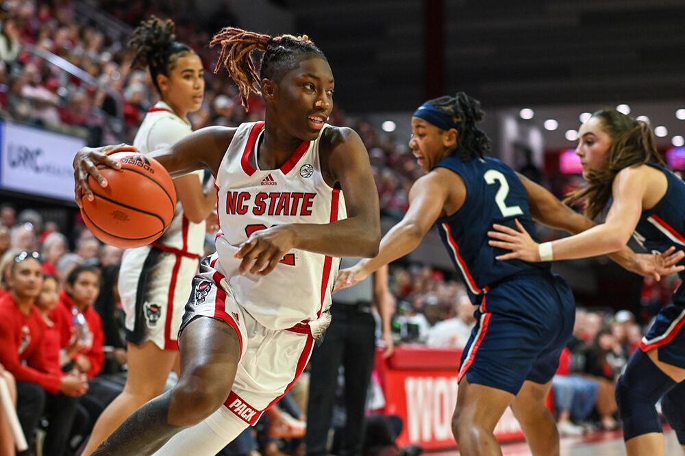 Junior guard Saniya Rivers breezes past the defensive effort during the game versus the UConn Huskies in Reynolds Coliseum on Sunday, Nov. 12, 2023. Rivers dominated UConn with 33 points and 10 rebounds. The Wolfpack beat the Huskies 92-81.