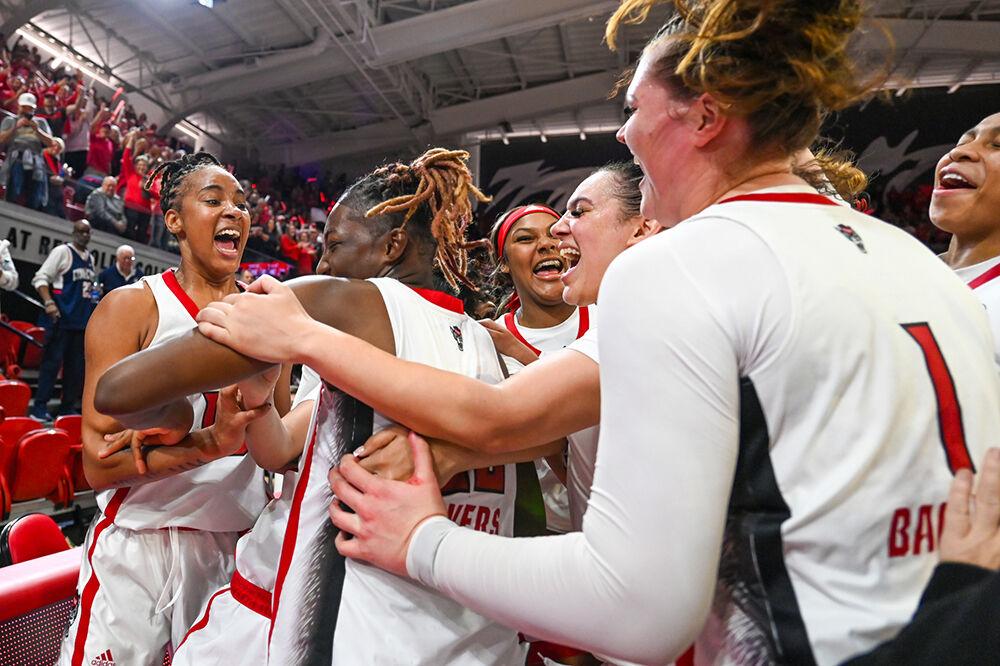 Junior guard Saniya Rivers is surrounded by her teammates after their win over the UCONN Huskies in Reynolds Coliseum on Sunday, Nov. 12, 2023. RIvers had a double double against UConn, scoring 33 points and having 10 rebounds. The Wolfpack beat the Huskies 92-81.
