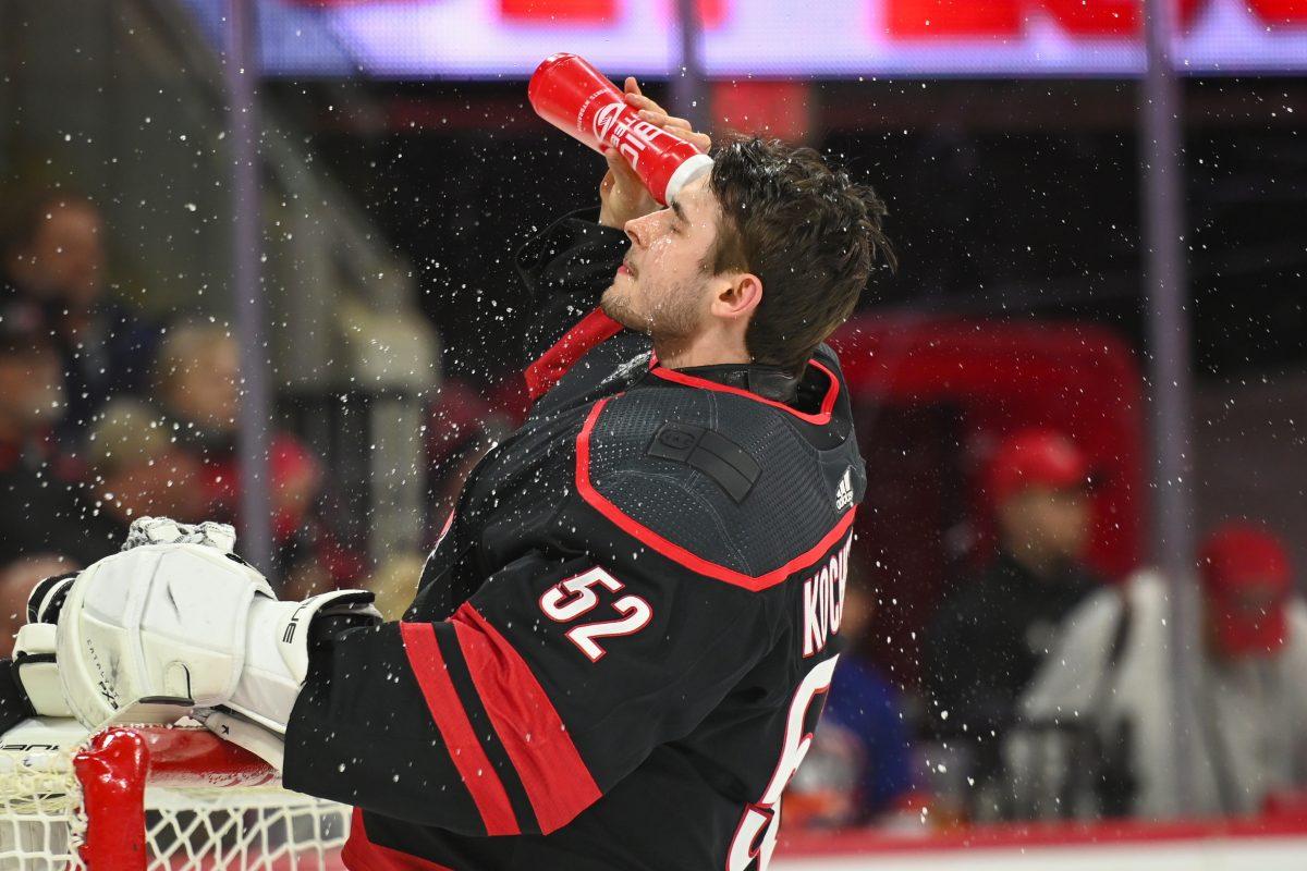 Carolina Hurricanes goalie Pyotr Kochetkov splashes his face with water before the game against the New York Islanders in PNC Arena on Thursday, Nov. 30, 2023. Kochetkov had a .688 save percentage saving only 11 od 16 shots on goal.