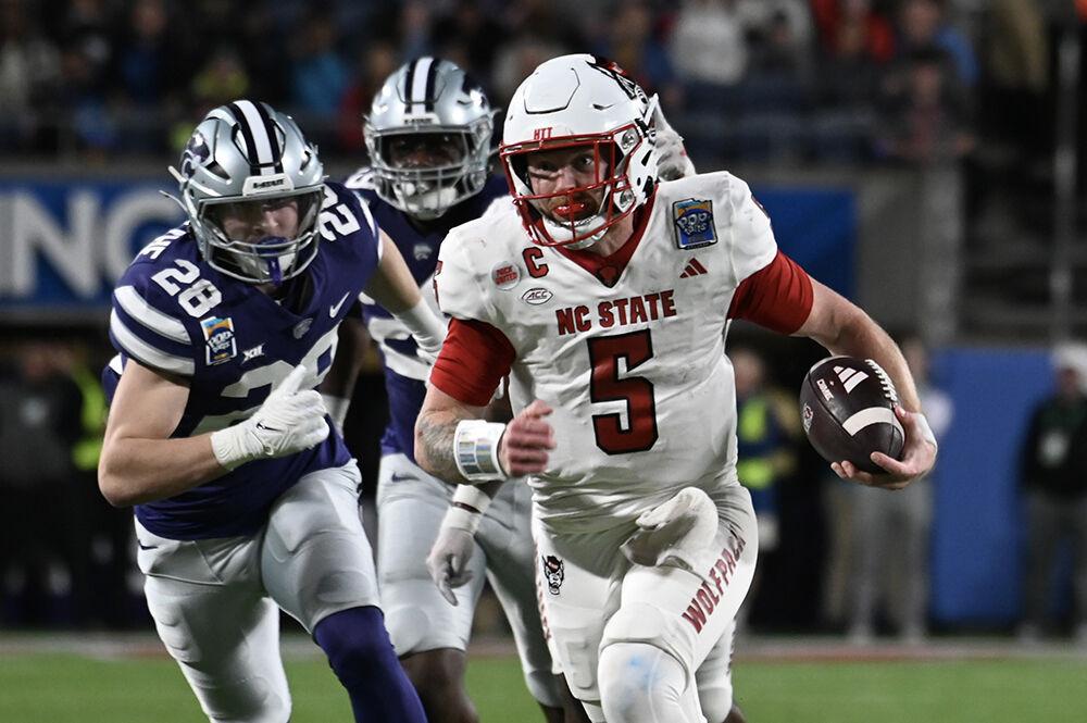 Graduate quarterback Brennan Armstrong rushes for a touchdown in the first half of the Poptart Bowl between the NC State Wolfpack and the Kansas State Wildcats in the Camping World Stadium in Orlando, Florida on Thursday, Dec. 28, 2023. Armstrong rushed for 121 yards. The Wolfpack lost to the Wildcats 28-19.