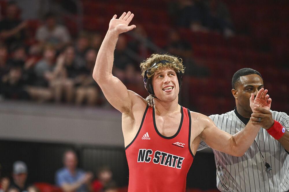 Redshirt sophomore Trent Hidlay celebrates winning the 184 bout during the NC State duel against App State on Friday, Nov. 4, 2022 in Reynolds Coliseum. Hidlay won his individual match by fall. NC State beat App State 26-12.
