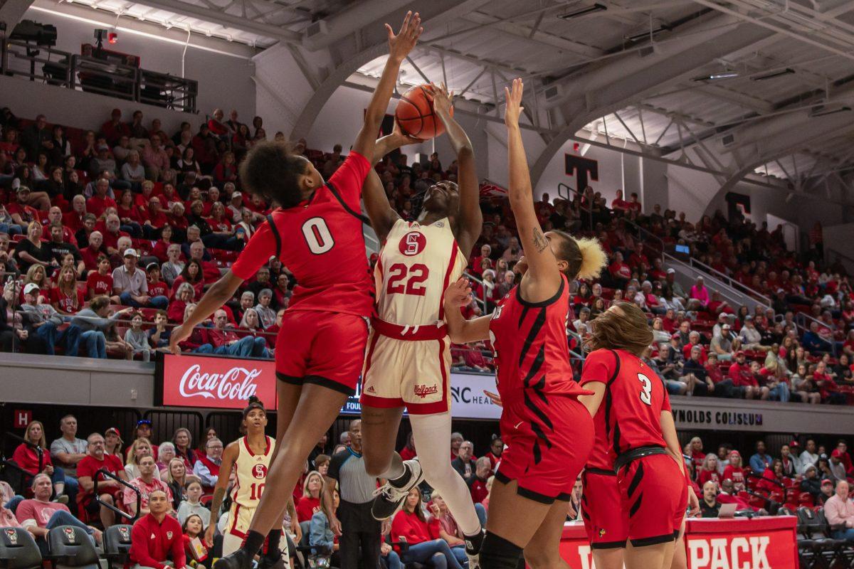 Junior guard Saniya Rivers jumps to shoot the ball during the game against Illinois State in Reynolds Coliseum on Sunday, Dec. 3, 2023. Rivers had four rebounds, six assists and scored nine points during the game. NC State beat Illinois 79-61.