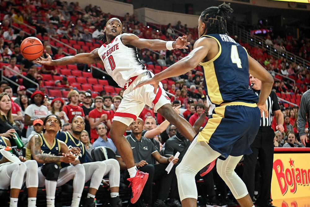 Graduate guard DJ Horne attempts to keep the ball inbounds during the game against Charleston Southern in PNC Arena on Friday, Nov. 17, 2023. Horne scored 18 points, made six rebounds, three assists and three steals. NC State beat Charleston Southern 87-53.