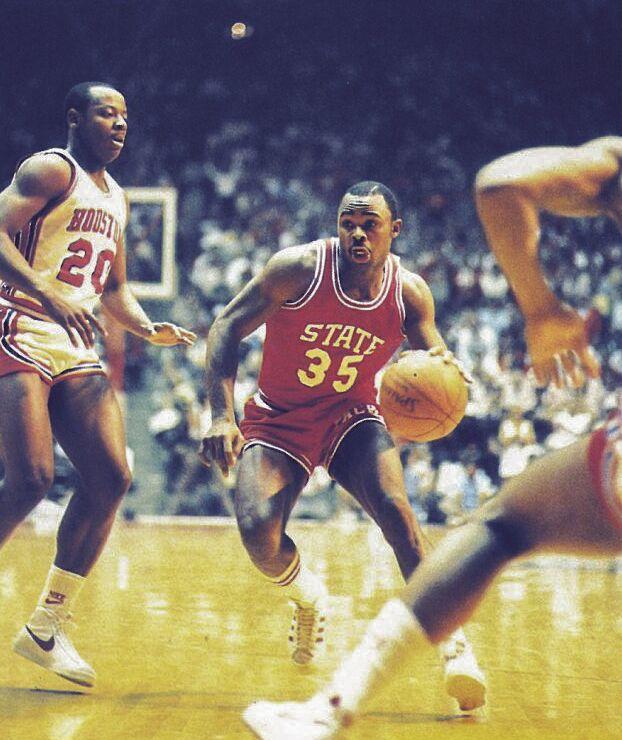 In this archive photo from April 4, 1983, Sidney Lowe drives against Houston guard, Alvin Franklin, in the 1983 National Title game in Albuquerque, N.M. The Wolfpack won 54-52, on a last-second dunk by Lorenzo Charles.