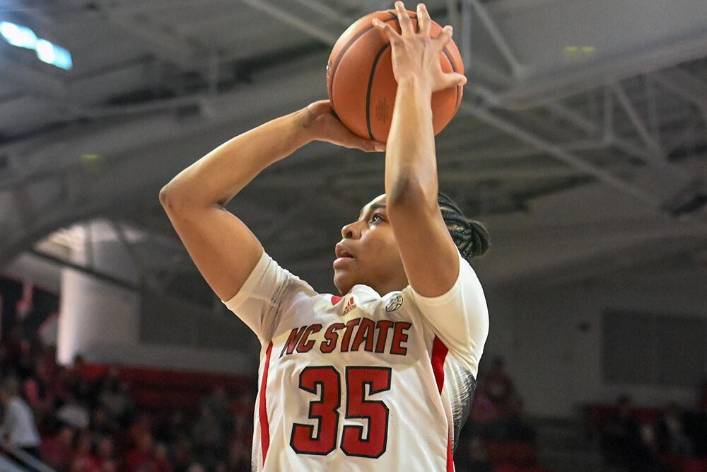 Freshman guard Zoe Brooks shoots the ball during the game versus Liberty at Reynolds Coliseum on Sunday, Dec. 10, 2023. NC State won the game 80-67.