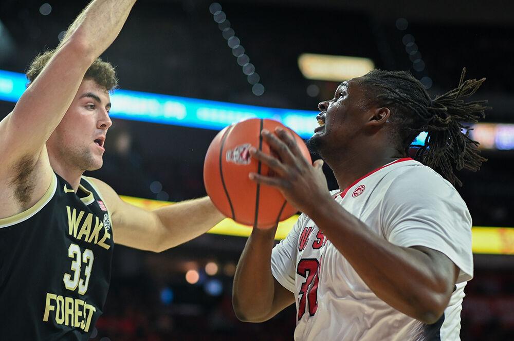 Graduate forward DJ Burns tries to get an open shot during the game versus the Wake Forest Demon Deacons in PNC Arena on Tuesday, Jan. 16, 2024. Burns scored 10 points against Wake Forest. The Wolfpack beat the Demon Deacons 83-76.