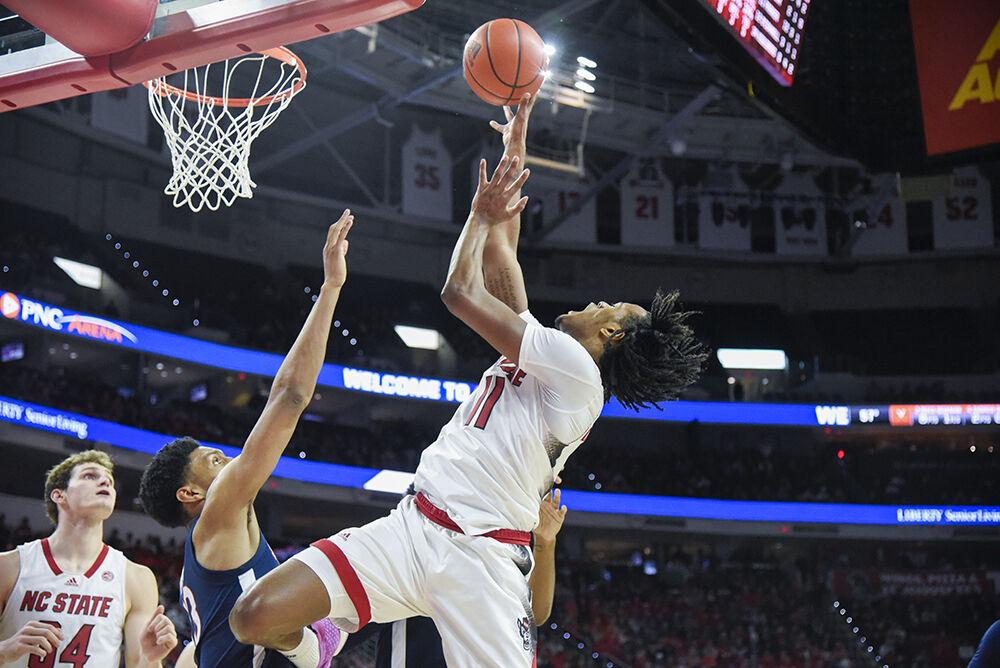 Freshman guard Dennis Parker rises for a layup during the game against Virginia in PNC Arena on Friday, Jan. 6, 2024. Parker scored 15 points. The Wolfpack defeated the Cavaliers 76-60.