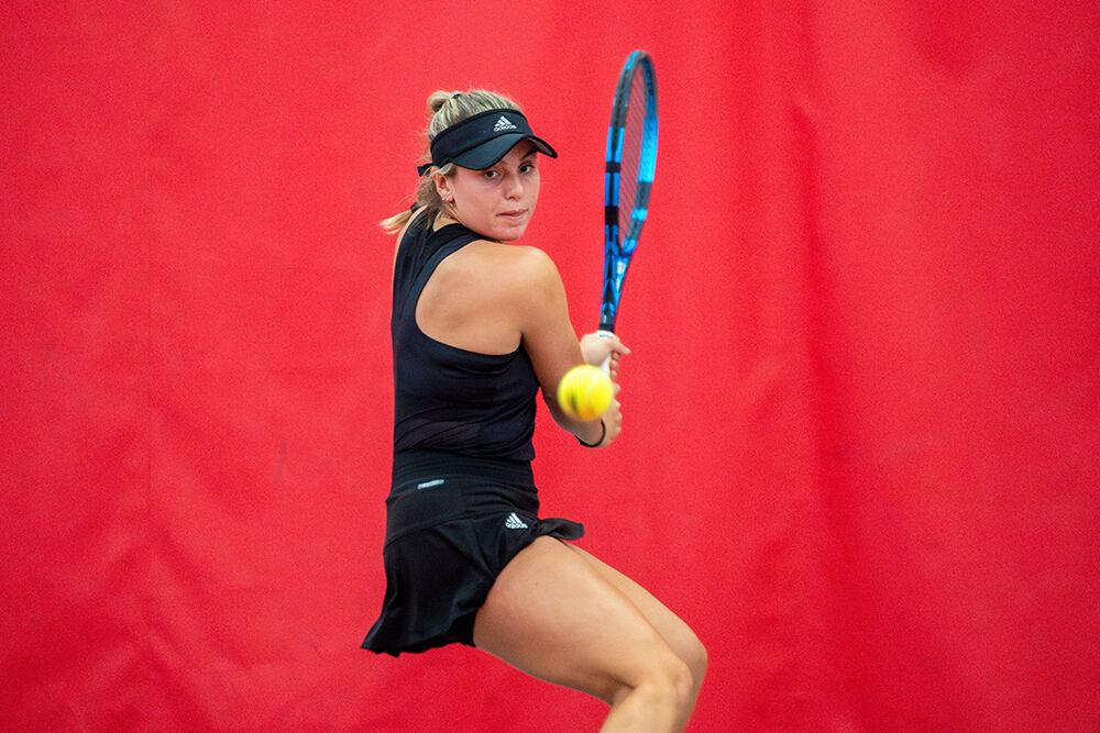 Freshman Gabriella Broadfoot backhands the ball during the match against North Carolina Central at J.W. Isenhour Tennis Center on Saturday, Jan. 20, 2024. Broadfoot won her singles match 6-0, 6-0. NC State beat NC Central 7-0.