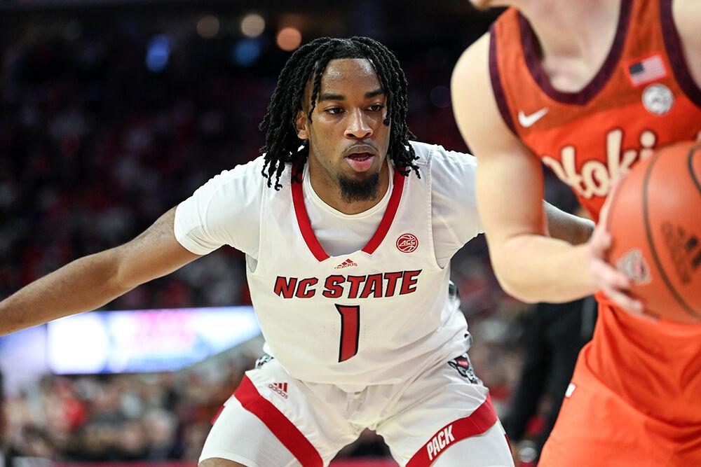 Junior guard Jayden Taylor guards an opponent while the ball is passed in during the game against Virginia Tech at PNC Arena on Saturday, Jan. 20, 2024. Taylor scored 15 points and made five rebounds. NC State lost to Virginia Tech 84-78.