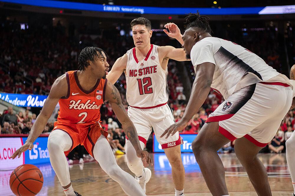 Graduate guard Michael O'Connell and graduate forward DJ Burns defend against the ball carrier during the game against Virginia Tech in PNC Arena on Saturday, Jan. 20, 2024. NC State lost to Virginia Tech 84-78.
