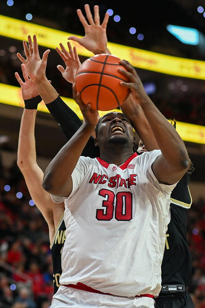 Graduate forward DJ Burns battles under the basket during the game versus the Wake Forest Demon Deacons in PNC Arena on Tuesday, Jan. 16, 2024. Burns scored 10 points against Wake Forest. The Wolfpack beat the Demon Deacons 83-76.