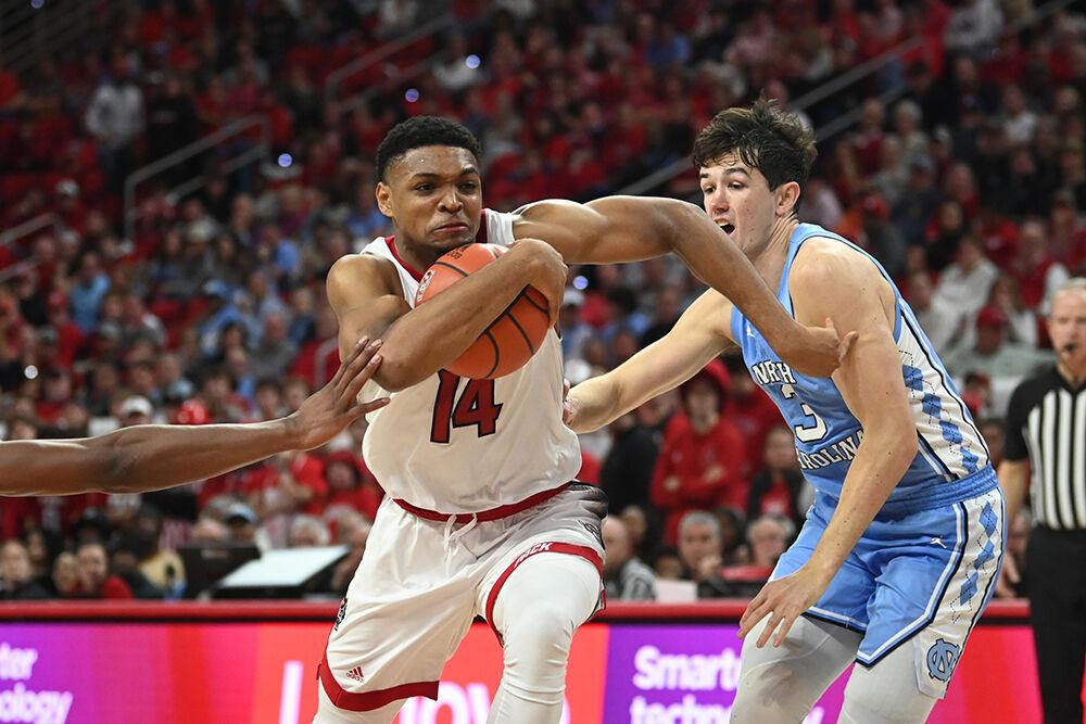 Graduate guard Casey Morsell dribbles through traffic on his way to the basket during the Wolfpack's home game against the UNC-Chapel Hill Tar Heels in PNC Arena on Wednesday, Jan. 10, 2024. Morsell finished with 12 points, scoring his 1000th college career points in the process. The Tar Heels beat the Pack 67-54.