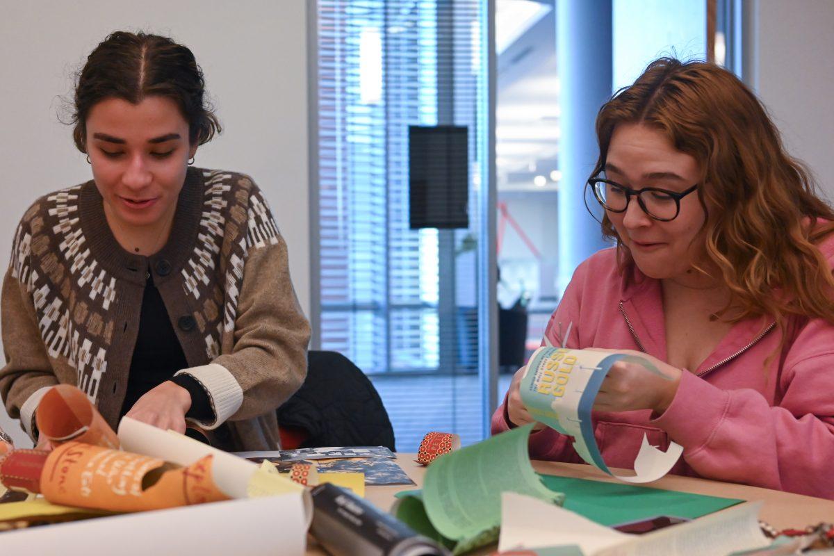 (left to right) Emma Gandy, a fourth-year in sustainable materials and technology, and Kate Macleod, a fourth-year in sustainable materials and technology, work on their vision boards at the Create Your Own Vision event on Thursday, Jan. 11, 2024 in Talley Student Union. The Create Your Own Vision Board event focused on students setting positive goals for the year.