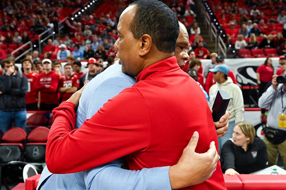 NC State head coach Kevin Keatts meets with UNC-Chapel Hill head coach Hubert Davis before the game in PNC Arena on Wednesday, Jan. 10, 2024. The Tar Heels beat the Wolfpack 67-54.