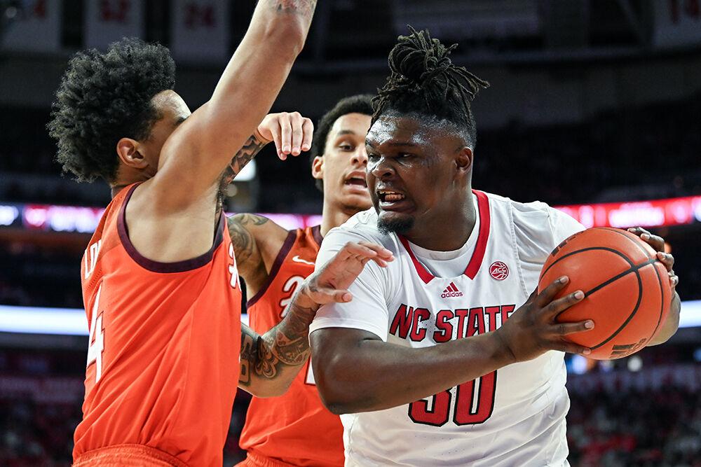 Graduate forward DJ Burns drives the ball to the basket during the game against Virginia Tech at PNC Arena on Saturday, Jan. 20, 2024. Burns scored eight points, had four rebounds and three assists. NC State lost to Virginia Tech 84-78.