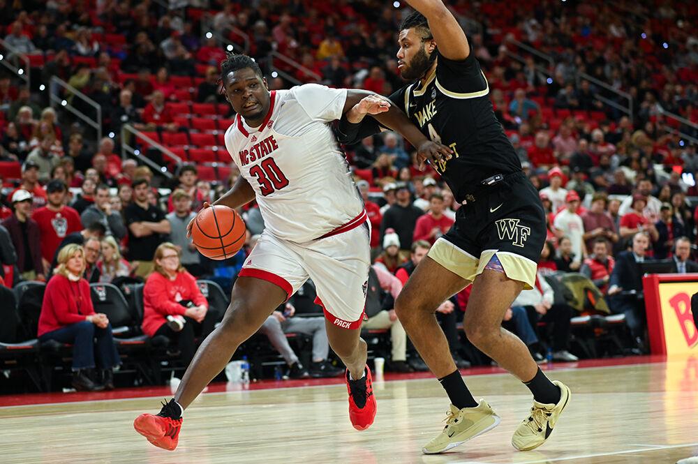 Graduate forward DJ Burns drives to the basket during the game versus the Wake Forest Demon Deacons in PNC Arena on Tuesday, Jan. 16, 2024. Burns scored 10 points against Wake Forest. The Wolfpack beat the Demon Deacons 83-76.