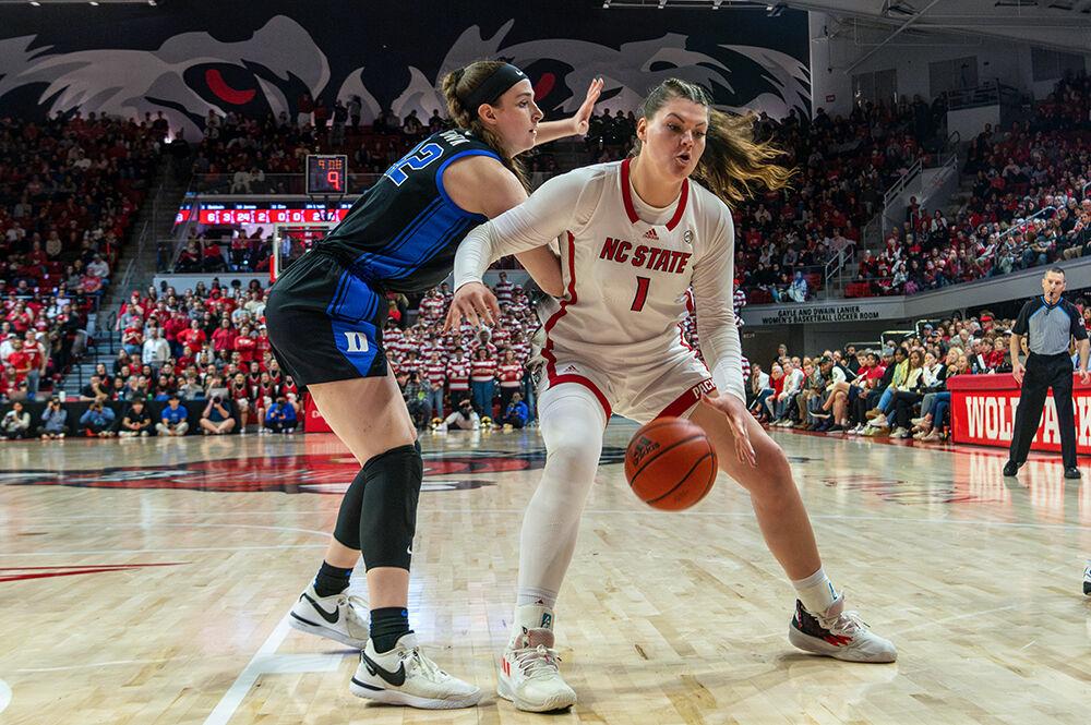Graduate student center River Baldwin evades an opponent during the game against Duke in Reynolds Coliseum on Sunday, Jan. 11, 2024. Baldwin scored six points for the Wolfpack.&#160;The Wolfpack beat the Blue Devils 72-57.