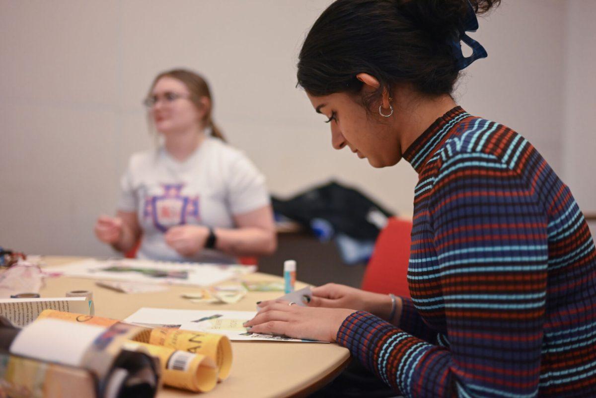 Saanika Naik, a first-year in industrial engineering, works on their vision board at the Create Your Own Vision event on Thursday, Jan. 11, 2024 in Talley Student Union. The Create Your Own Vision Board event focused on students setting positive goals for the year.